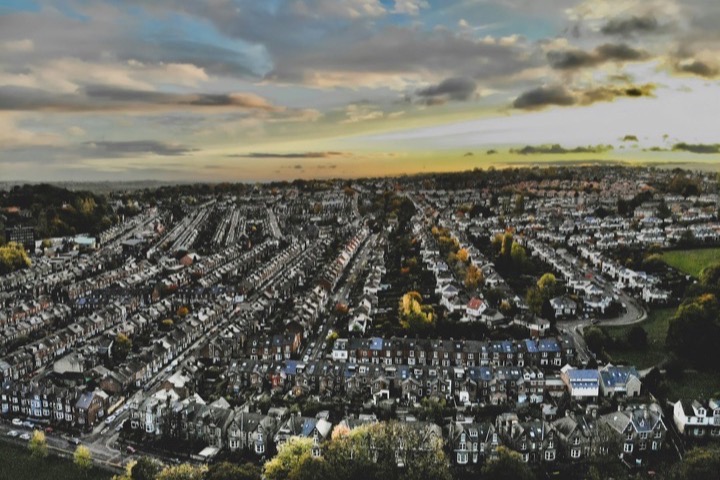 Aerial view of terraced streets in a northern town at dusk