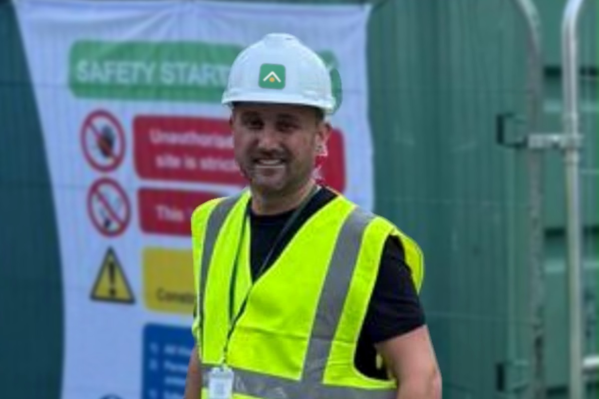 Miles Sharples, Managing Director of Energy Giants, on site in an Energy Giants hard hat