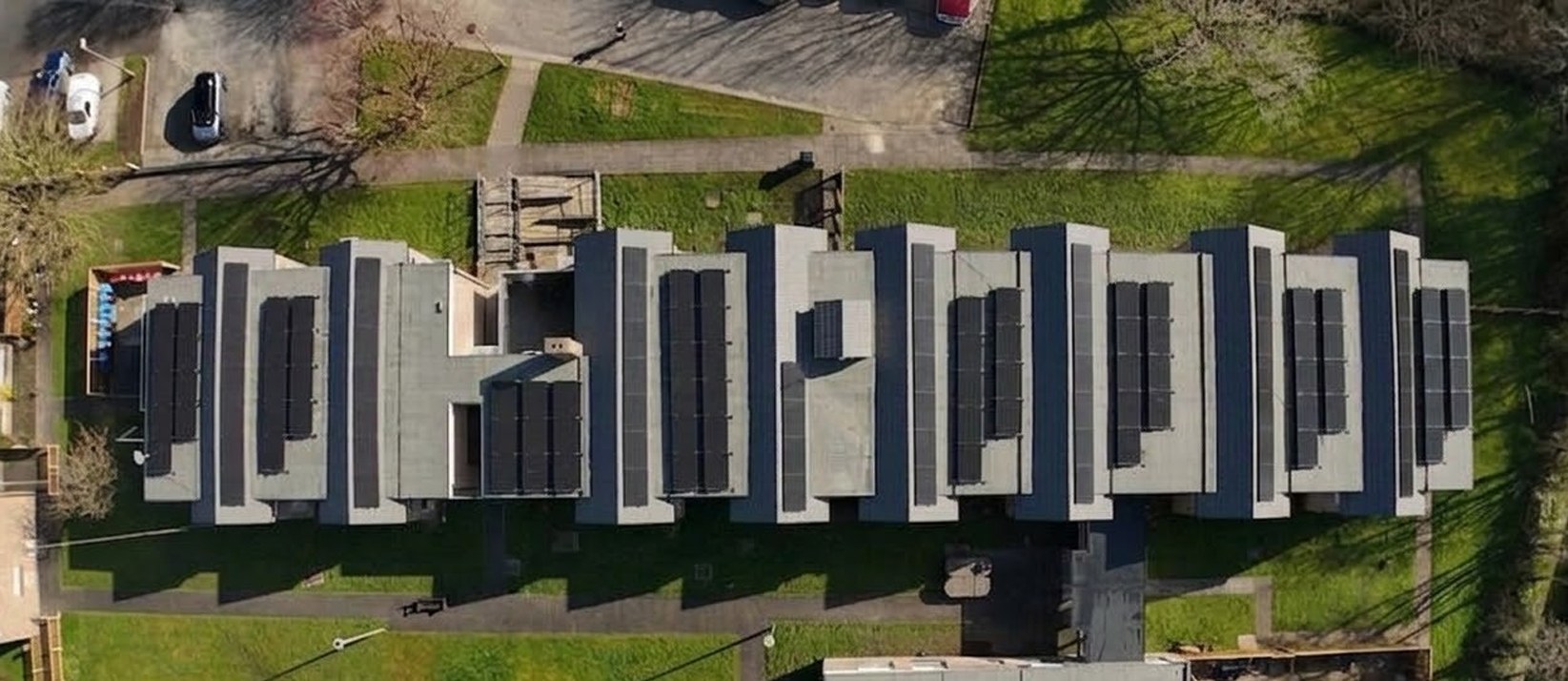 Torentum Court from above in March 2026, with fifteen renewed flat roofs