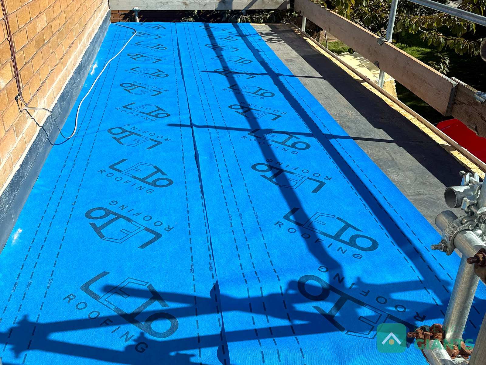 A vapour control layer laid over an existing flat roof in Ruthin