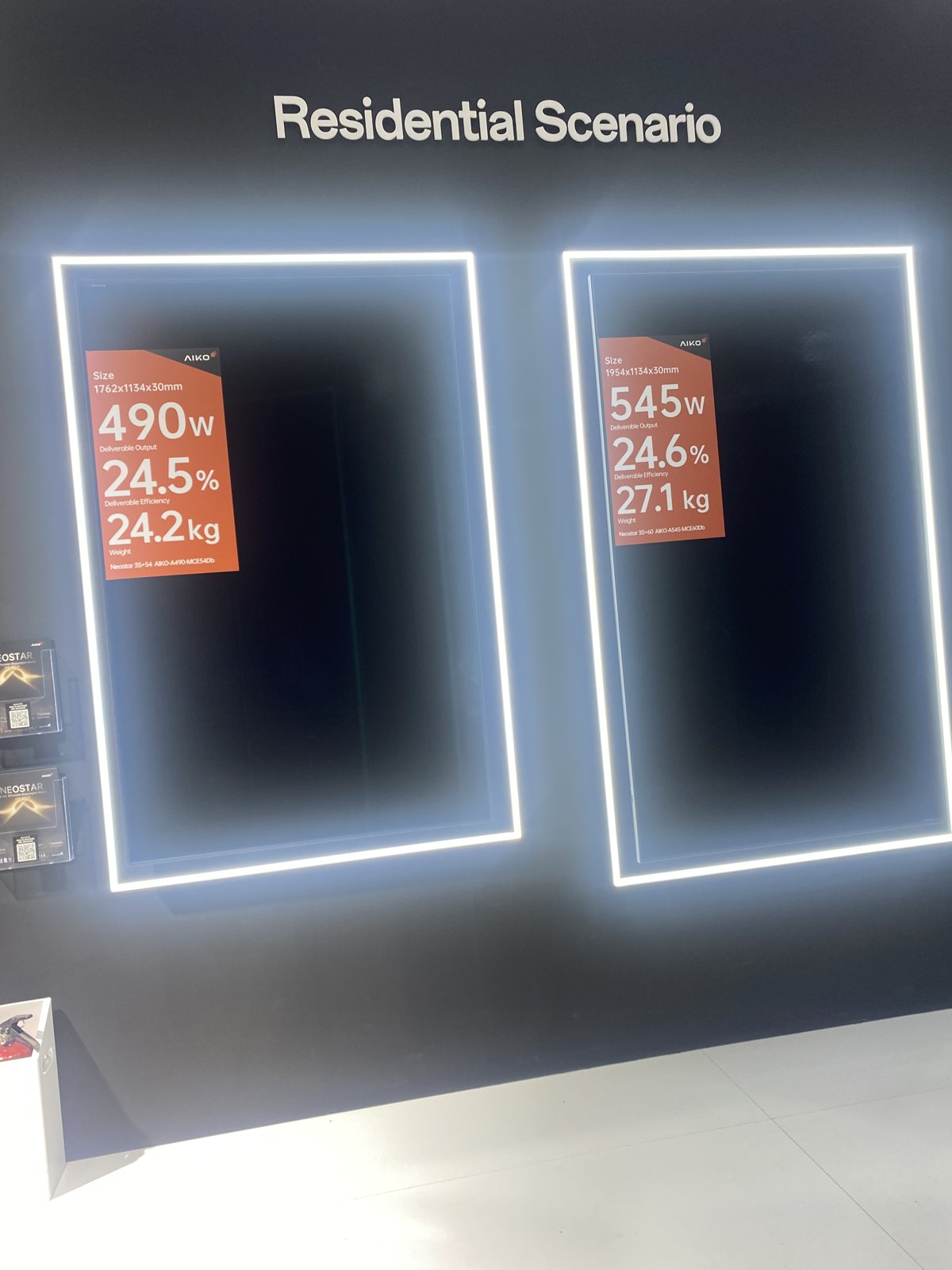 Two Aiko Neostar residential panels on the Munich stand with placards showing 490 W and 545 W outputs