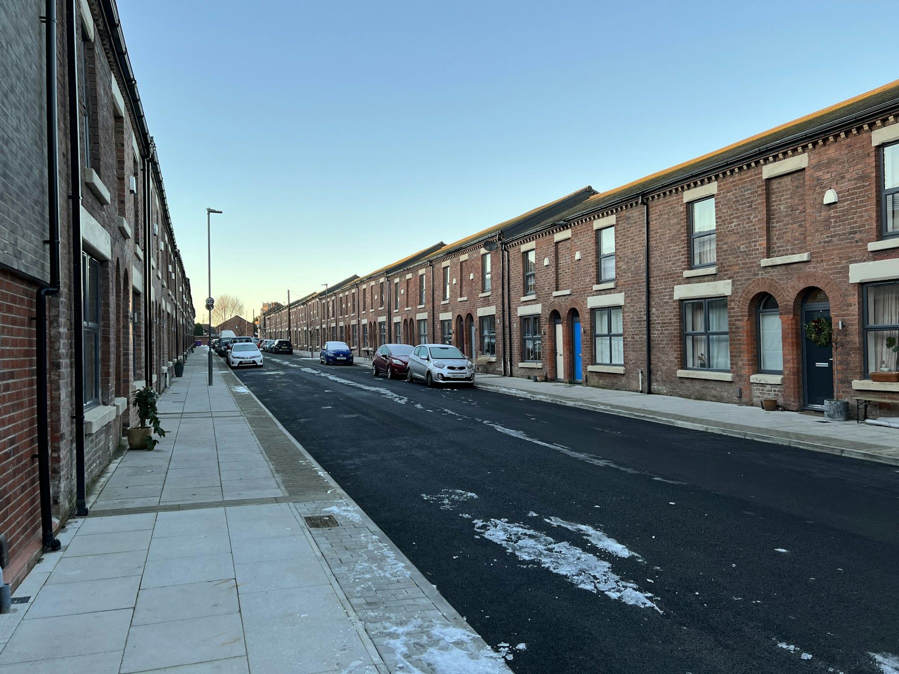 A long street of red brick terraced houses: the solid wall homes internal wall insulation is made for
