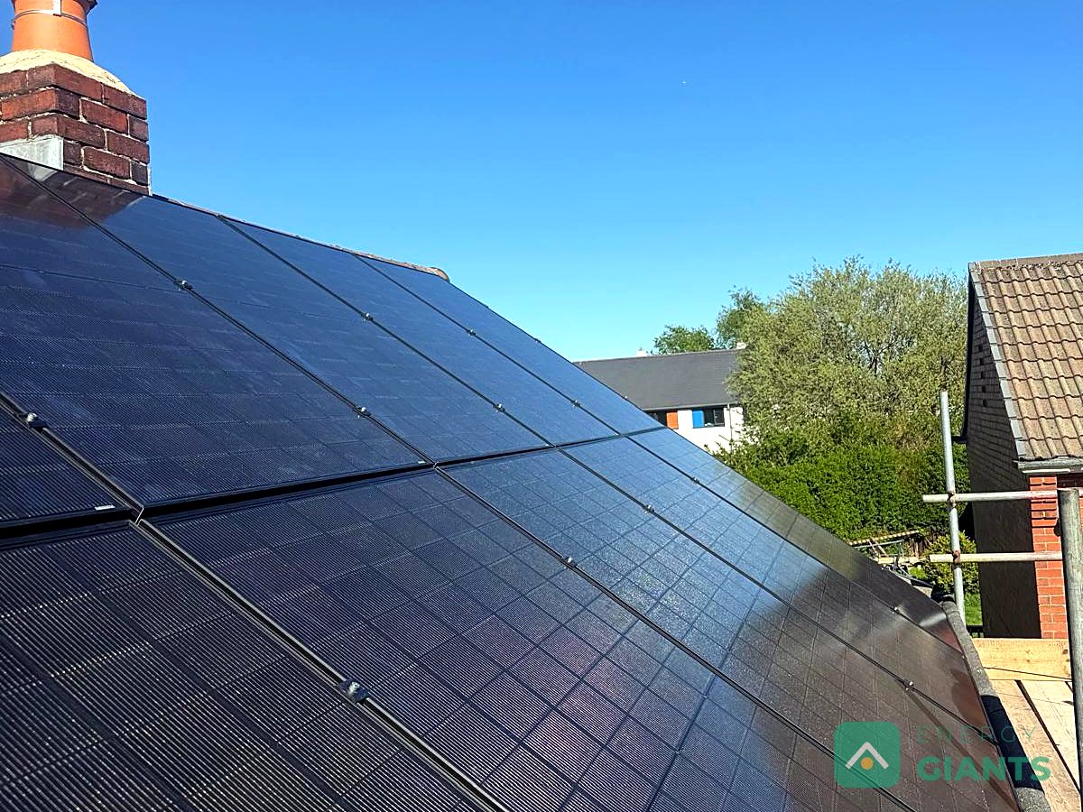 Black Aiko solar panels on a south facing house roof in Birstall, fitted by our team