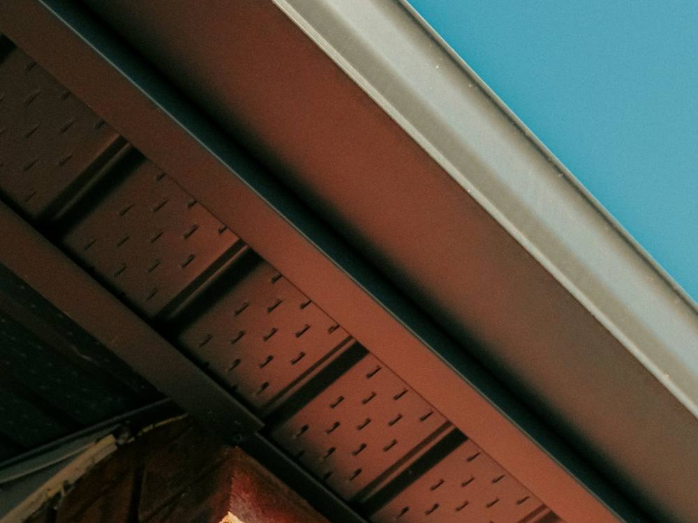 Brick eaves with a vented soffit and the gutter line above