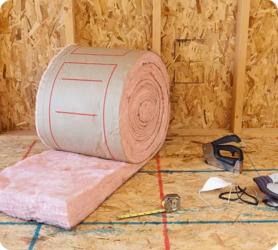 Rolls of loft insulation material on site