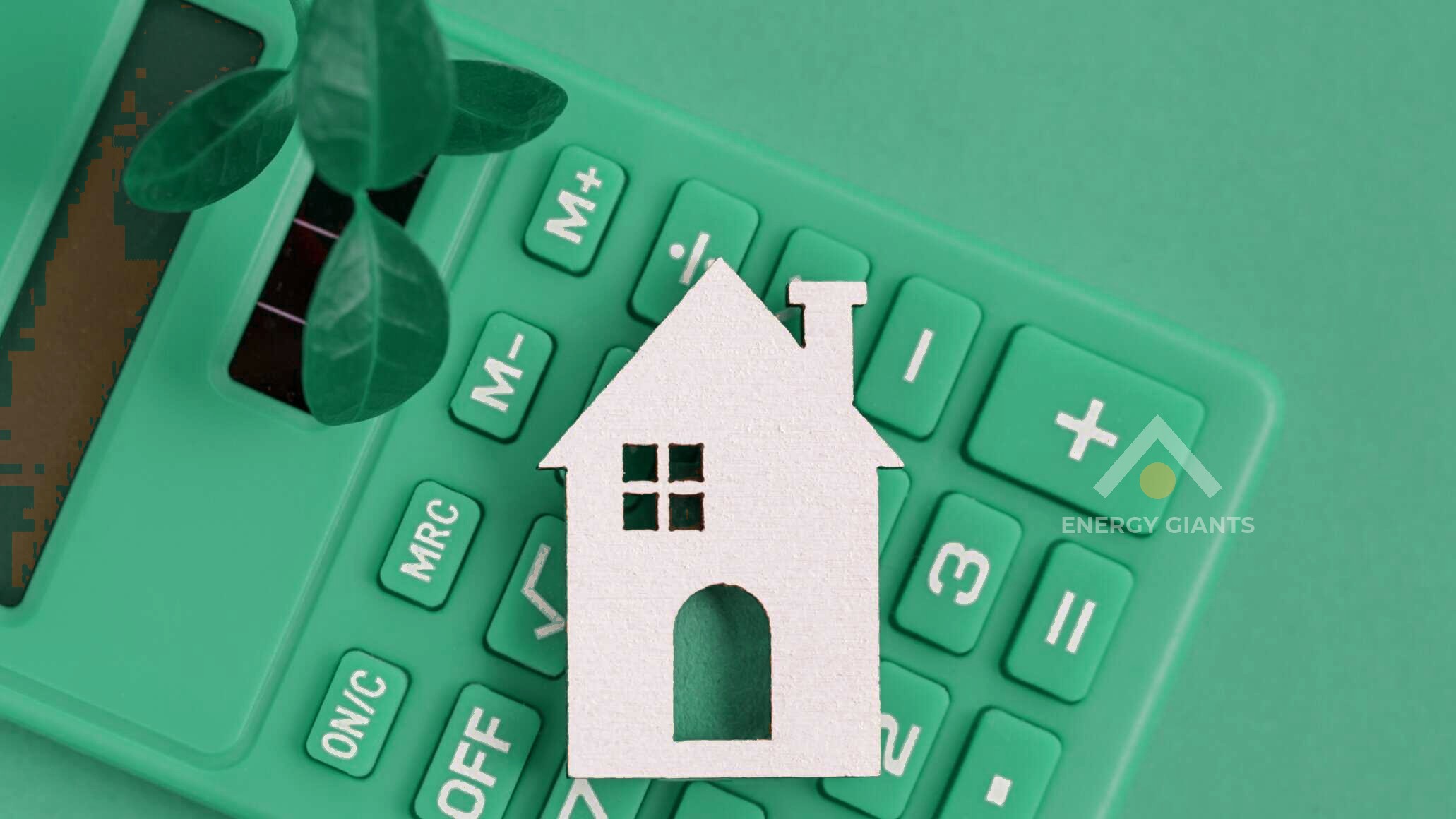 A white model house on a green calculator, next to a small plant: the cost of a greener home, worked out